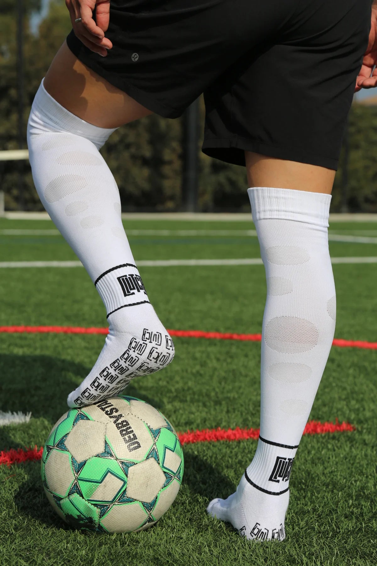 Original Clutch shoot showing white Flex Flow calf mesh and the Clutch grip pattern on the sole