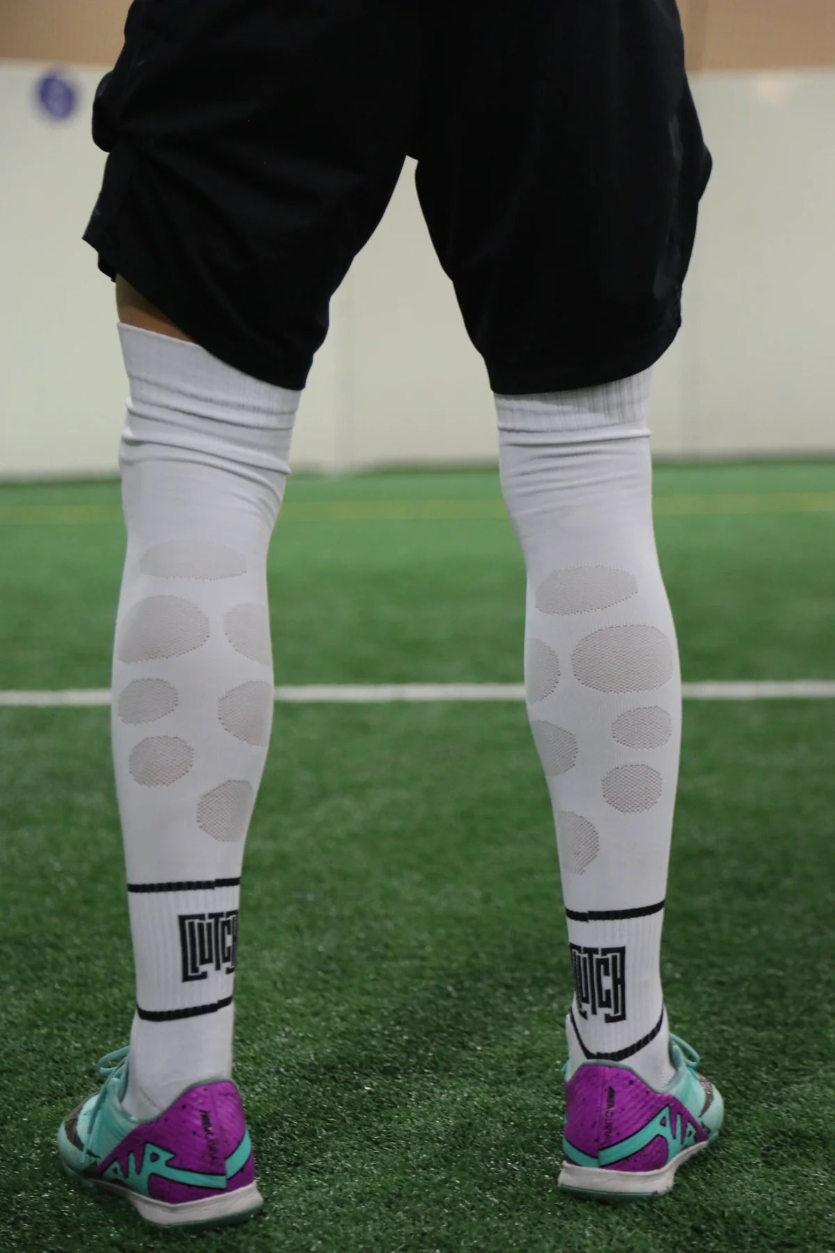 Original Clutch shoot: woven oval Flex Flow zones on the back of white socks